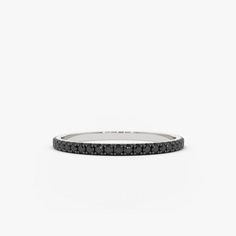 a black diamond bracelet on a white background