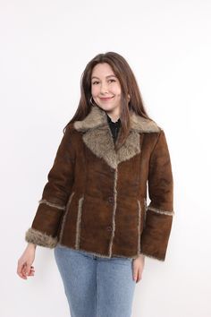 Hi! This is vintage from 90s brown sherpa jacket with button up closure. This retro style penny lane coat made of  POLYESTER. The model in the photo is 170 cm tall and is wearing a LARGE size grunge jacket. ( L - sizes on the tag). But, be careful, this is a vintage size, it is better to check the measurements below in the product description. Sleeve - 40cm / 15.74inch; Width - 48cm / 18.89inch; Length - 60cm / 23.62inch. All measurements are taken seam to seam while lying flat. Sleeve measureme Fitted Vintage Brown Winter Outerwear, 90s Brown Long Sleeve Outerwear, Brown Sherpa Jacket, Y2k Winter, Vintage Brown Outerwear With Faux Fur Trim, Grunge Jacket, Vintage Brown Single-breasted Long Sleeve Outerwear, Penny Lane Coat, Vintage Single-breasted Outerwear In Vintage Brown