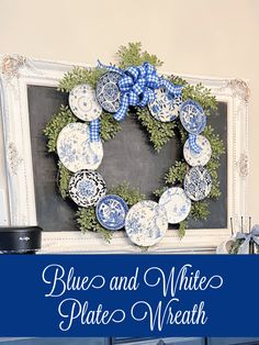 a blue and white plate wreath on top of a chalkboard with the words blue and white plate wreath above it