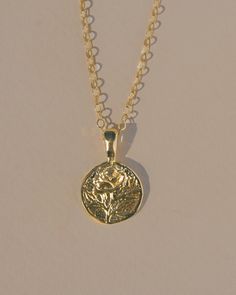 Handmade Rose coin charm necklace, designed to attract growth, fortune, opportunity and romance.  Options: Sterling Silver Gold Vermeil + 14k gold-filled chain Cable chain // Box Chain Length:  16” - 18" - 20"   Details: 14 mm pendant Made with recycled metals Made in the USA Rose Gold Charm Necklace With Coin Pendant Gift, Rose Gold Coin Pendant Charm Necklace As Gift, Rosa Gold, Handmade Rose, Silver Chain Style, Demi Fine Jewelry, Amber Jewelry, Recycled Metal, Gold Filled Chain