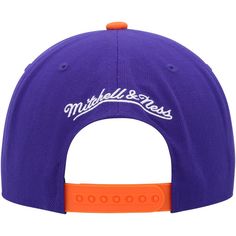 a purple and orange hat with the word mitchell & nesss on it's front