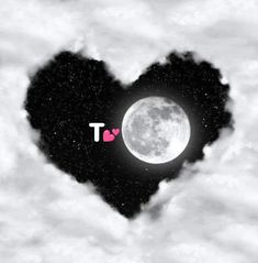 a black and white photo with a heart in the middle, surrounded by stars and clouds