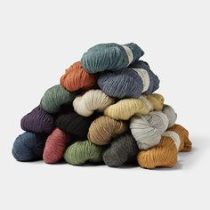 a pile of skeins of yarn sitting on top of each other