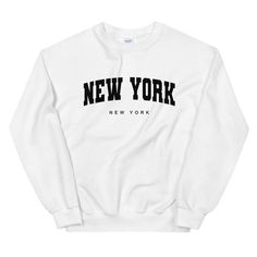 NYC Varsity Crewneck Sweatshirt | NYC Sweatshirt | Vintage NYC Crewneck Sweater | New York City Sweatshirt | Unisex Sweatshirt A sturdy and warm sweatshirt bound to keep you warm in the colder months. A pre-shrunk, classic fit sweater that's made with air-jet spun yarn for a soft feel and reduced pilling. * 50% cotton, 50% polyester * Pre-shrunk * Classic fit with no center crease * 1x1 athletic rib knit collar with spandex * Air-jet spun yarn with a soft feel and reduced pilling * Double-needle White T-shirt With Ribbed Cuffs For College, White Slogan Sweater For Streetwear, Streetwear White Slogan Sweater, White Crew Neck Sweatshirt With Text Print, White Varsity T-shirt For Winter, Sporty White Sweater With Text Print, White Sporty Sweater With Text Print, White Text Print Sweater For College, Basic Crew Neck Top For College