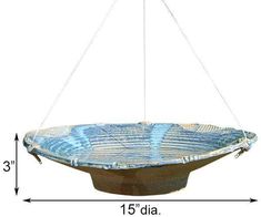 a large blue bowl hanging from a ceiling fixture with measurements for the length and width