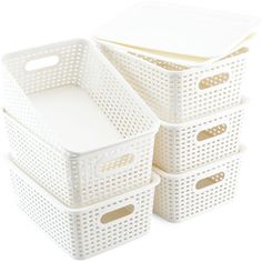 three white storage baskets stacked on top of each other