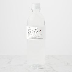 a bottle of water sitting on top of a marble counter