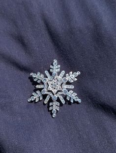 Adorable snowflake stock tie pin. Various sizes of iridescent gemstones set in silver toned snowflake  Measures 2.5" from end to end Silver Christmas Party Brooch, Silver Brooches For Christmas Party, Silver Christmas Party Brooches, Elegant Silver Brooch For Christmas, Silver Snowflake Jewelry For Formal Occasions, Formal Silver Snowflake Jewelry, Holiday Wedding Jewelry Brooch, Formal Christmas Snowflake Jewelry, Holiday Formal Brooch Jewelry