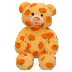 a yellow teddy bear with orange polka dots