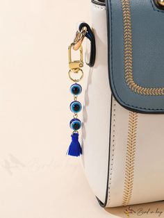 BirdinBag - Colorblock Eye Bag Charm with Tassel Accent: Chic and Trendy Design Blue Shoulder Bag With Tassels For Daily Use, Blue Shoulder Bag With Tassels For Everyday Use, Blue Bag With Tassels For Everyday Use, Blue Everyday Bag With Tassels, Rectangular Tassel Bags Perfect For Gifts, Rectangular Tasseled Bags As Gifts, Blue Tassel Bags For Daily Use, Ab Patterns, Symbol Of Luck