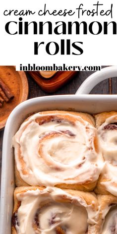 cinnamon rolls with cream cheese frosting in a baking dish