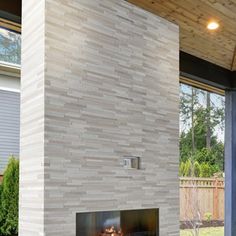 a modern fireplace in the middle of a patio