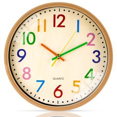 a wooden clock with multicolored numbers on the front and sides is shown against a white background