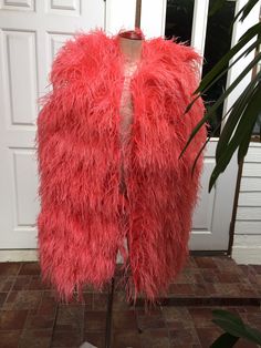 SGinstar Micky Salmon Orange Ostrich Feather Jacket Feather Vest Made to order Please check my size chart before ordering if it's doesn't fit with my size chart please measure bust waist and hips -Coat length 36 Inches -Coat made with ostrich feathers -Color: more than 18 colors -Dry clean only Spring Party Fur Coat With Faux Fur Lining, Pink Feather Trim Outerwear For Fall, Fall Pink Outerwear With Feather Trim, Party Outerwear With Feather Trim And Faux Fur, Party Fur Coat With Feather Trim, Spring Party Outerwear With Feathers, Ostrich Feather Jacket, Feather Cocktail Dress, Feather Vest