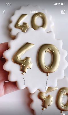 someone is holding up some gold numbers for the number forty six years old to celebrate