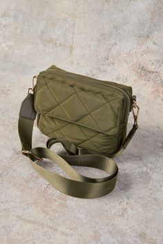 Great for travel or as an everyday accomplice, our Medina Soft Crossbody Bag in Khaki features elegant, quilted detailing at the front and a comfortable guitar strap. Storage includes a main zip compartment and outer slip pocket. Your next adventure awaits! Weekend Crossbody Shoulder Bag With Removable Pouch, Crossbody Bags With Adjustable Strap For Weekend Trips, Shoulder Bag With Adjustable Strap For Weekend Trips, Quilted Crossbody Satchel For Everyday Use, Versatile Shoulder Bag For Weekend Trips With Adjustable Strap, Quilted Crossbody Shoulder Bag For Everyday Use, Quilted Shoulder Bag For Travel, Quilted Travel Crossbody Bag, Quilted Crossbody Travel Bag