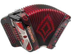 an accordion with red and black designs on it