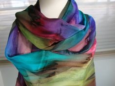 "This gorgeous multi-colored streaked scarf is hand painted and is 100% silk.  Hand hemmed as well. Lovely mixture of many colors dripping into each other to create a lovely picture for you to wear with your favorite outfit.  Imagine this with a Winter White outfit!!  I challenge you to find an outfit it won't look great with!! This scarf is 11\" x 58\"-60\" (27.940 cm x 147.32cm-152.40 cm) or 17\" x 72\" (43.180 cm x 182.88 cm) and should be dry cleaned or hand washed in cold water. Low iron st Stevie Nicks Shawl, Silk Fans, Silk Painting Ideas, Winter White Outfit, Hand Dyed Silk Scarf, Painted Rainbow, Wearing Color, Dyed Silk, Painted Silk