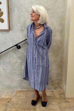 Description Like our breezy Boyfriend Dress? If you’d like a slightly longer, over-the-knee version, too, the Olivia Shirtdress is for you. Fitted through the shoulders and chest, this dress tapers gradually to the hem creating a loose fit through its waist and hips. Details Indigo with white shadow stripes 100% lightweight cotton fabric 3 ¼-inch-wide two-button cuffs Classic point collar Oversized chest pocket Side pockets built into each side seam Chest pocket Engraved mother-of-pearl buttons Shirttail-style hem Do's and Don'ts Made with a 100% cotton fabric, we suggest you machine-wash your Olivia Shirtdress in cool water using the gentle cycle. Shake out any wrinkles and hang to dry, or tumble dry low, removing promptly. Iron on cotton setting, if desired. Alternatively, you can profes Boyfriend Dress, Dressing Over 50, Clothes Spring, White Shadow, Do's And Don'ts, Mother Of Pearl Buttons, Pearl Buttons, Indigo Blue, Over The Knee