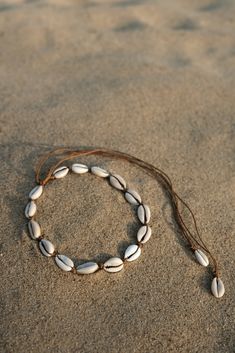 What started off as an Instagram trend last summer, is now a full blown shell-mania and we totally get it - after all, nothing says summer like shells do. Make your neck, wrist and ankle look chicer than ever with our cowry jewellery. Ethically handmade in Bali, can be worn with absolutely anything. The trend transcends seasons and shell chokers are now paired with thick winter sweaters, while cowry anklets look great with fall booties. Our jewellery is 100% waterproof and washable so you can en Sea Shells Necklace, Cowrie Jewelry, Seashell Choker, Necklace Shell, Cowrie Shell Necklace, Ocean Inspired Jewelry, Cowry Shell, Shell Choker, Beach Necklace