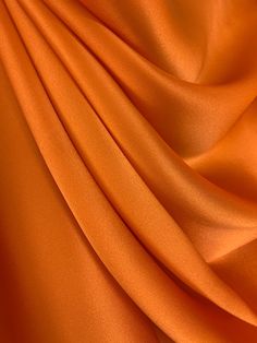 Orange Pure Mulberry Silk Fabric Width 44 inch (112 cm), Industry Thickness : 19 m/m (Momme) Content: 100% Pure Silk Silk Charmeuse Fabric possesses not only the finest aesthetics, but retains the fluid sophistication most sought after in silk fabrics. At the top of its class, Charmeuse Fabric is a satin weave that allows this fabric to retain a soft feel and supple drape that most high-end designers crave, this fabric has many applications as it is composed of both a shiny face on one side and Shiny Face, Wedding Brand, Silk Texture, Charmeuse Fabric, Orange Texture, Mulberry Silk Fabric, Silk Satin Fabric, Orange Satin, Textile Texture