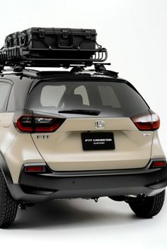 an suv with luggage strapped to the roof