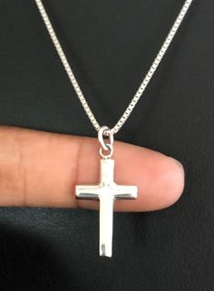 Classic Cross Necklace, Sterling Silver Cross PendantNECKLACE FEATURES:Metal:  All components are made from solid .925 Sterling Silver Model is wearing 16" in length solid .925 Sterling Silver Chain Length available:  16", 18" or 20"MEASUREMENT:  Sterling Silver Cross PendantHeight: 28 mm (1.1 inches)Width: 14 mm (0.55 inch)Your Sterling Silver Cross Necklace will arrive in a gift box, beautifully wrapped and ready for giftingPlease send me a message if you have any questions before or after pla Beaded Ankle Bracelets, Jewelry Cross, Pendant Minimalist, Silver Model, Faith Necklace, Sterling Silver Cross Necklace, Fire Opal Necklace, Sterling Silver Cross Pendant, Silver Cross Pendant