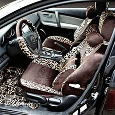 the interior of a car is decorated with leopard print