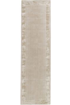 a beige rug with fringes on the bottom and sides, in front of a white background