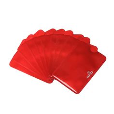 six red plastic coasters on a white background