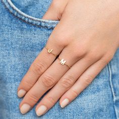 Exclusively ours, the Mini Uppercase Letter Ring is our newest addition to our letter collection! Handcrafted in 18-karat gold, the mini initial is set on a thin yellow gold band. The perfect, personal gift for yourself, your mom, your BFF, or anyone on your list! Wear it alone or stacked with other letters from the collection. Ring size: 6.5 Letter measures approximately 0.25" wide Exclusively available on jennifermeyer.com or in our boutique! Custom sizes available upon request. Email shop@jen Letter Collection, Hand Jewelry Rings, Word Ring, Mom Ring, Letter Ring, Jennifer Meyer, Gold Jewelry Simple, Classy Jewelry, Fancy Jewellery