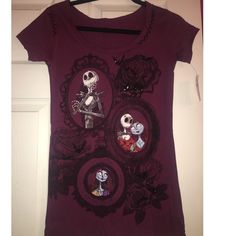 a women's t - shirt with skeletons and roses on it