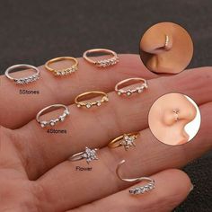 there are many different types of rings on someone's hand, including one with a nose ring