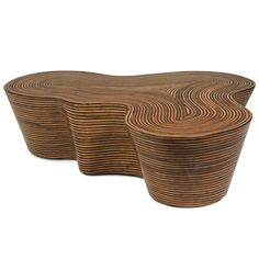 three wooden tables with wavy designs on each side and one is made out of wood