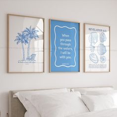 two framed pictures hang on the wall above a bed with white linens and pillows