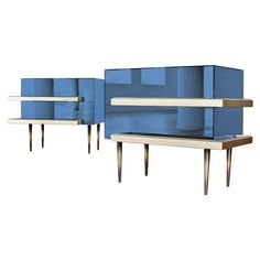 two blue and white sideboards with one shelf on each side, the other is open