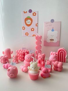 there are many pink cupcakes that have been made to look like animals and bears