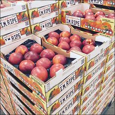 several boxes of apples stacked on top of each other