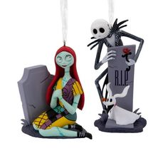 two ornaments that look like they are in the form of jack and sally from the nightmare