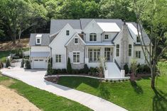 an aerial view of a large white house