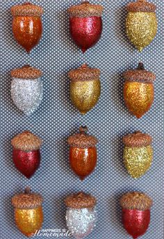 the twelve acorns are painted gold, red, and silver in different colors