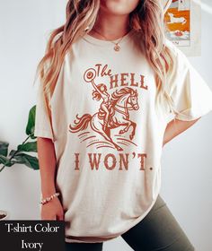 The Hell I Won't  Comfort Colors Shirt | Trendy Western Retro Vintage Graphic Tee | Gift For Country Style Girl | Western Cowgirl Shirts | Country Girl Shirt Comfort Colors introduces its garment-dyed t-shirt; a fully customizable tee made 100% with ring-spun cotton. The soft-washed, garment-dyed fabric brings extra coziness to your wardrobe while the relaxed fit makes it an excellent daily choice. The double-needle stitching throughout the tee makes it highly durable while the lack of side-seam Western T Shirts For Women, Western Shirts For Women, 23 Summer, Country Girl Shirts, Girl Western, Tee Designs, Shirt Sayings, Country Clothing, Cowgirl Shirts