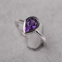 ~~~~~~~~~~~~~~~~Ring details~~~~~~~~~~~~~~~~metal: silver/14k white(rose/yellow) goldcenter stone:  Pear shape 6*9mm (1.33ct) amethystaccent stone: NoneNOTE: if it is silver or white gold, it will be get plated with rhodium~~~~~~~~~~~~~~~~Customization is available~~~~~~~~~~~~~~~~you can change, add or remove any parts of the ring if you have good idea. I can add special engraving inside the shank of the ring by free (words, date, simply simbles and so on) too. I am happy to help out or make any Fine Jewelry Teardrop Purple Ring, Fine Jewelry Purple Teardrop Ring, Purple Teardrop Fine Jewelry Ring, Sterling Silver Pear-shaped Ring For Anniversary, Sterling Silver Pear Shaped Ring For Anniversary, Teardrop Amethyst Ring For Anniversary, Pear Shaped Sterling Silver Anniversary Rings, Pear-shaped Sterling Silver Anniversary Ring, Elegant Pear-shaped Amethyst Promise Ring