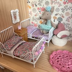 a doll house bedroom with crocheted furniture and accessories