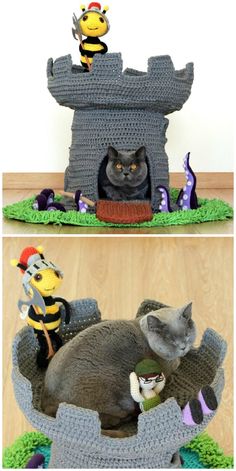 a cat laying on top of a bed next to a toy bee and other toys