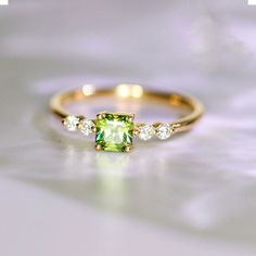 •Condition: Brand new•Center Stone: Natura Olivine Garnet from African, Asscher Cut, 5mm, Approx 0.75ct•Side Stone: Natural white diamond, round cut (VS1 clarity and F color)•Ring Weight: 2.65g (depend on the ring size)•Metal Purity: Optional Each piece is made-to-order with care and special attention to detail. all items are made with conflict-free diamonds and gems.Size: made to orderThe item will be gift wrapped and shipped.---------------------------------------------------------Available in 14k Gold Green Diamond Princess Cut Ring, Princess Cut Green Diamond Ring In 14k Gold, Green Princess Cut Diamond Ring In 14k Gold, 14k Gold Asscher Cut May Birthstone Ring, 14k Gold Green Diamond Ring With Prong Setting, Green Diamond Ring With 14k Gold Prong Setting, Green Diamond Ring With Accent Stones In 14k Gold, Diamond Asscher Cut Rings For May Birthstone, Dainty Green Diamond Ring For Formal Events