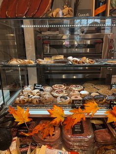 a display case filled with lots of pastries