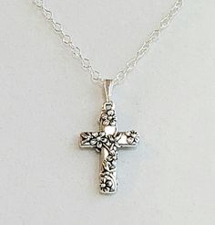 "- Gorgeous 925 Antique Sterling Silver Plated Pewter Cross Pendant, or Necklace, in Floral motif. Pewter Cross is Lead-Free and cast in the USA. See Photo #1-4. - Petite 925 Sterling Silver Pinch Bail (holder). - 925 Sterling Silver Filled Oval Cable Chain with 925 Sterling Silver Lobster Claw Clasp. See #5. - Cross measures 5/8 x 1\". - Chain Length is 20\". . Clasp type can be changed to Toggle, Hook and Eye or Torpedo Barrel upon request at no cost. Give us a Note on Etsy at Checkout with an Antique Silver Sterling Silver Cross Pendant Necklace, Vintage Silver Cross Pendant Jewelry, Silver Tarnish-resistant Cross Pendant Jewelry, Vintage Cross Necklace, Nickel-free Antique Silver Cross Pendant Necklace, Antique Silver Nickel-free Cross Pendant Jewelry, Gold Fashion Necklace, Meaningful Jewelry, Cross Jewelry