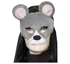 a woman with long black hair wearing a gray mouse mask on top of her head