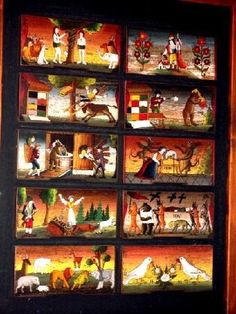 an art display with many different pictures on the front and back panels, all painted to look like animals